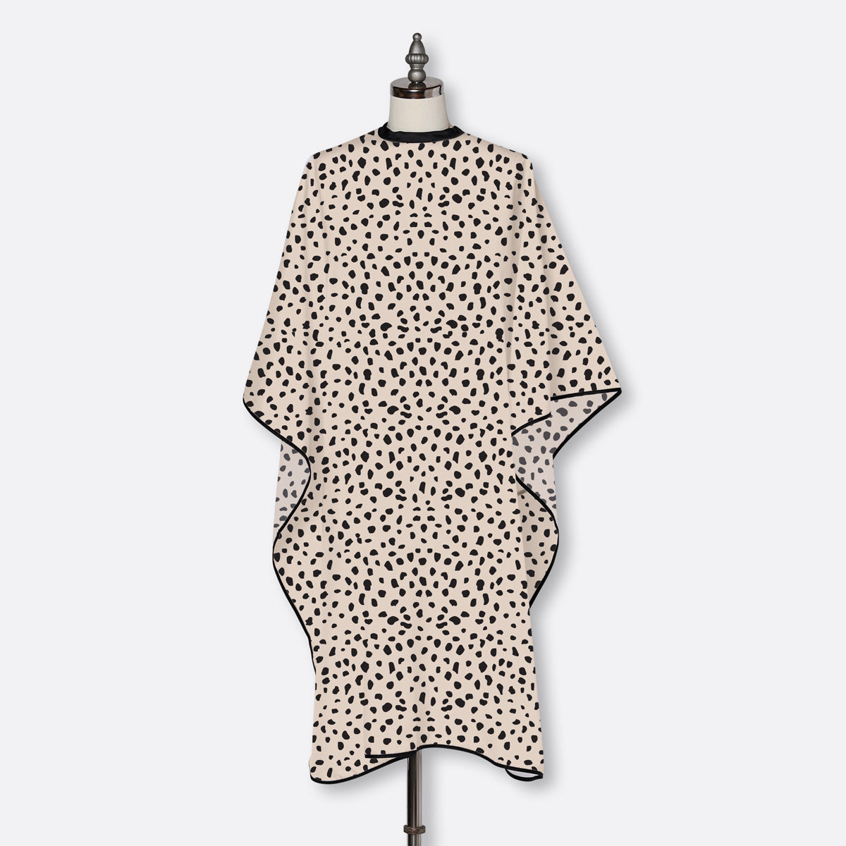FROMM Cheetah print cape on a mannequin against a white background
