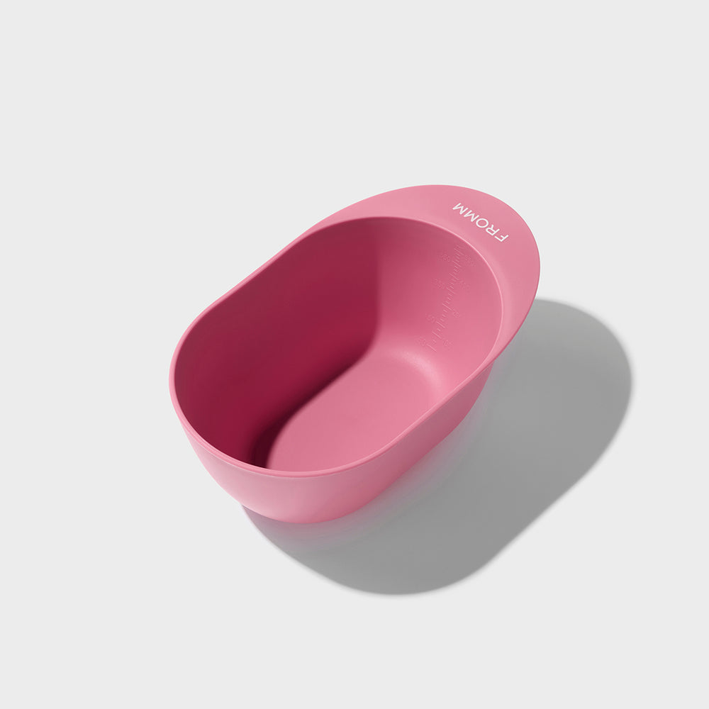 Pink color mixing bowl with 'FROMM' branding on a light gray background