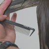 A video of a stylist using the shears to cut clients hair 