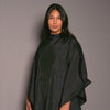 model wearing FROMM hair salon cape in black